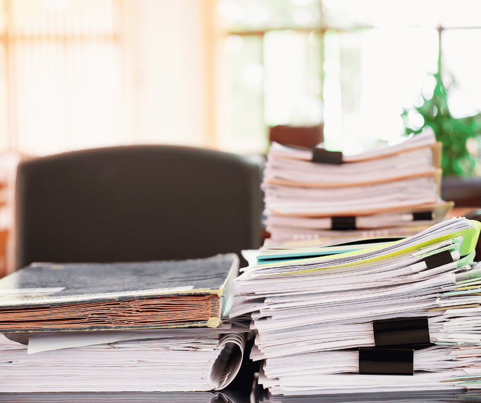 Stacks of documents on a office desk